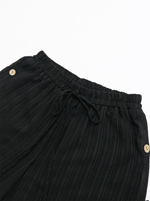 Pantalon large côtelé texturé pour femme avec boutons fantaisie sur le côté