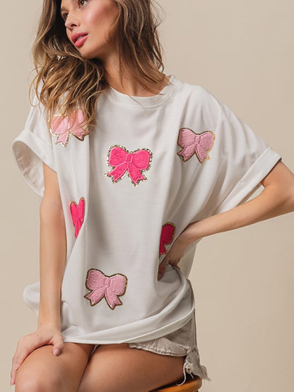 Sparkle T-shirt surdimensionné festif avec nœuds brodés pour femme 
