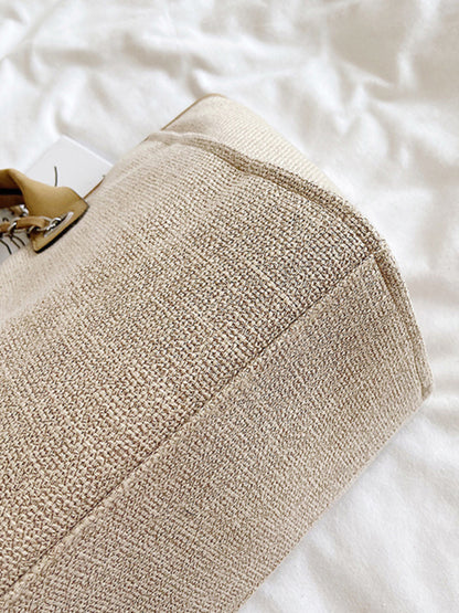 Grand sac seau texturé à bandoulière